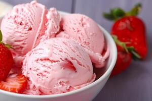 Indulge in the luscious experience of enjoying a creamy vegan strawberry ice cream, a delightful dairyfree dessert made with fresh strawberries, perfect for a refreshing summer treat photo
