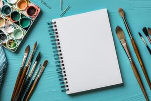 This mockup features a sketchbook, paintbrushes, and a colorful watercolor palette, ideal for artists seeking inspiration and essential tools to express their unique creative vision photo