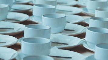 a row of empty cups can be a void waiting to be filled. The cups are still empty, open to be filled with anything. video