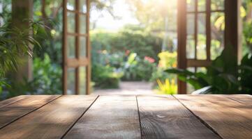 An empty wooden tabletop, beautifully set against a softly blurred green garden backdrop, serves as the perfect canvas for product displays while evoking a serene and peaceful ambiance photo