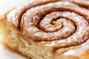 A single slice of a cinnamon roll. photo
