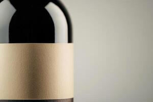 A close-up of a wine bottle label with a blank space beside it. photo