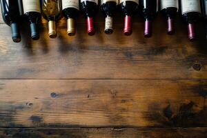 Wine bottles on a wooden table with a blank space. photo