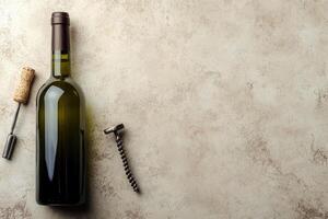 Wine bottle and corkscrew on a textured background with blank space. photo