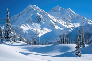Majestic mountains covered in snow under a clear sky. photo