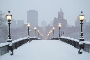 A city bridge covered in snow with the skyline in the background. photo