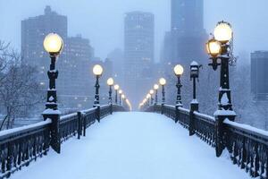 A city bridge covered in snow with the skyline in the background. photo