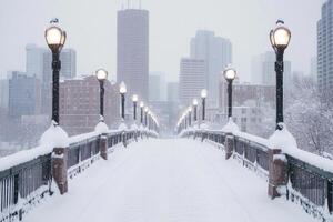 A city bridge covered in snow with the skyline in the background. photo