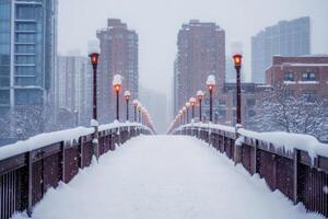 A city bridge covered in snow with the skyline in the background. photo