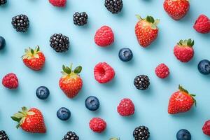 A fresh flat lay of spring berries like strawberries, blueberries, and raspberries. photo