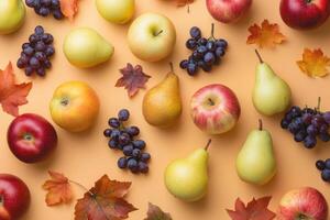 A warm-toned flat lay of autumn fruits like apples, pears, and grapes. photo