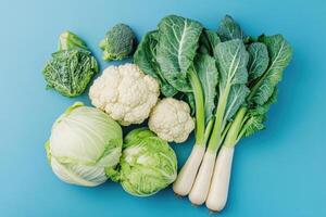 Crisp winter vegetables on a cool blue background. photo