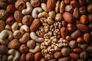 An array of nuts forms a rich, textured, and earthy background. photo