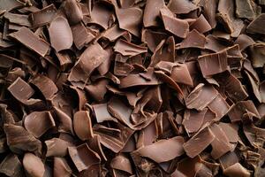 A textured layer of shredded chocolate forms a rich, indulgent background. photo