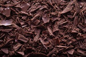 A textured layer of shredded chocolate forms a rich, indulgent background. photo