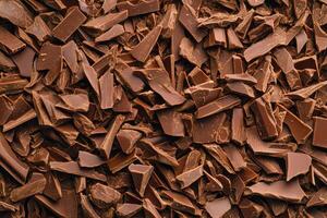 A textured layer of shredded chocolate forms a rich, indulgent background. photo