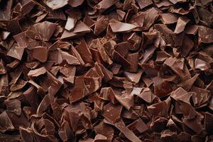 A textured layer of shredded chocolate forms a rich, indulgent background. photo
