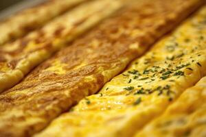 A rich array of French omelettes creates a savory, elegant background. photo