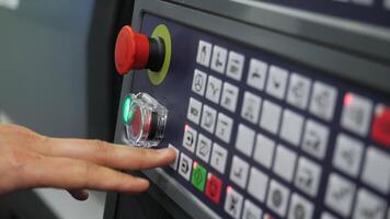 Close-up pressing buttons of machine control panel. Media. Starting production machine using control panel. Panel with button for controlling production machines photo