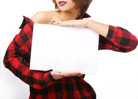 Woman holding an empty sheet of paper A4. Leaflet presentation. Pamphlet hold hands. Sheet template. Isolated over white background photo