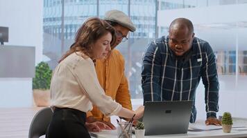 Entrepreneur collaborates with a real estate team of experts to plan a high class office space renting during a tour. Client negotiating the contract and reaching an agreement. Camera B. photo
