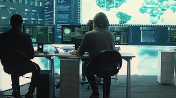 Cyber operations center with governmental hackers working on digital security activities during hybrid war. Specialists team ensuring security and malware detection, cyber surveillance. Camera A. photo