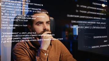 Tech freelancer looking at AR hologram on computer display while doing programming from home. Remote employee using augmented reality technology to visualize lines of code photo