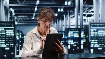 Cloud computing business executive working in data center housing GPU dedicated servers that can process AI tasks with high efficiency, investigating rigs used for machine learning showing pitfalls photo
