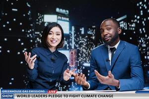 World leaders fighting climate change news on midnight talk show, diverse tv hosts talking about activists taking measures to reduce greenhouse gas emissions. Media journalists hosting live segment. photo