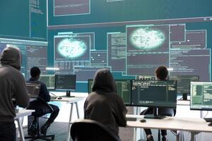 Cyber defense expert examining data on a big screen in governmental agency, focusing on cyber operations and digital security. Hacker ensures protection against cybercriminal activities. photo