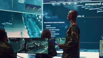 General headquarters under ruling of army IT professional that reviews insight about a new national safety mission. Command sergeant major briefing his marine corps troops with big data. Camera A. photo