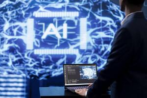 Programmer using AI cognitive computing to extract usable information from complex data on laptop. Employee using artificial intelligence tech on notebook to accelerate complex calculations photo