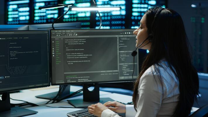Data center call center agent responsible for providing logistics support to businesses. Worker in server farm establishment oversees infrastructure systems and communicates with engineers, camera A