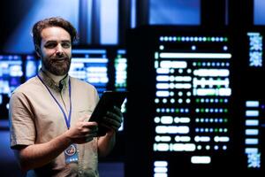 Engineer inside high tech facility providing computing resources needed for artificial intelligence to process extensive datasets for training. Server farm storing data used for machine learning photo