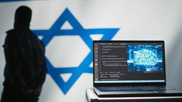 AI software on laptop used by state of Israel security services to prevent terrorism attacks. Artificial intelligence tech used by Mossad agency to defend borders, isolated over Israeli flag, camera B photo