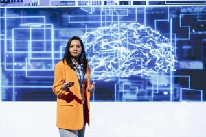 Tech startup leader using convention as platform to offer latest AI services and products. Businesswoman uses microphone to talk with investors interested in artificial intelligence photo