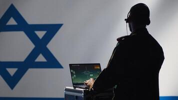 Israeli air defense command operator conscript using radar system on laptop to detect incoming ballistic missiles. IDF army soldier scanning rockets approaching borders, deploying shields, camera A photo