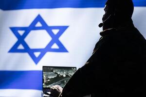 Mossad Israeli agent combating organized crime and terrorism using detection system on laptop. Israel intelligence corps officer protecting national sovereignty by tracking terrorists entering country photo