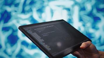 Software developer with tablet programming artificial intelligence computing simulating human brain. Close up of IT professional using device, building AI machine learning algorithms, camera B photo