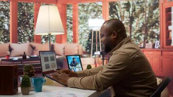 Business owner meeting on videoconference call with shareholders to obtain funding for development project. Entrepreneur attends important startup conference at his house, budget growth. Camera B. photo