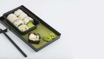 sushi roll in bento box with white background. isolated. photo