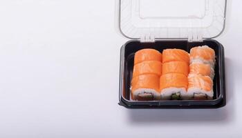 slice of sushi roll in bento box with white background. isolated. photo