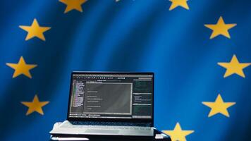 European Union intelligence agency using laptop to protect against mass propaganda tools affecting elections. EU security service engaging in psychological operations using device, camera B photo