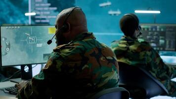 Government intelligence officers in control room manage surveillance operations, analyze real time data and coordinate security measures to protect national interests. Secret service. Camera A. photo