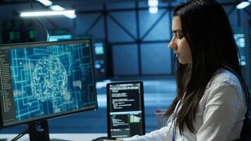 Admin does maintenance on server hub to optimize it for data processing requirements of artificial intelligence workloads. Expert inspects data center used for machine learning, camera A photo