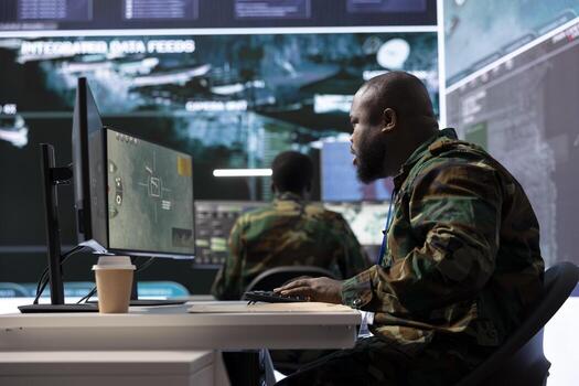 Army staff in a military base of operations oversees intelligence gathering to collect satellite data and missions details, providing real time surveillance for defense. Studying cctv radar systems. photo