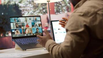 Business owner presenting the financial data reports to the investors members of the board, discussing on online videocall about expansion plans and new funding. Accounting analysis. Camera A. photo