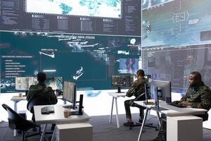 Military personnel in a modern command center handle critical information, collecting live surveillance data to maintain security protocols. Team of army crew working on reconnaissance. photo