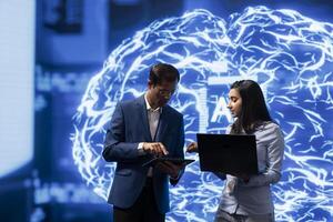 Software engineers use neural networks modeled after human brain to solve complex problems. IT experts in high tech workspace using artificial intelligence to look at data photo