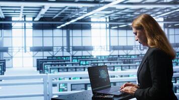 Computer scientist in data center using artificial intelligence computing simulating human brain. IT professional working on notebook with AI machine learning algorithms, camera B photo